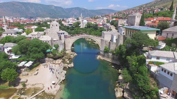 Crowd watching people jumping of the bridge in Mostar