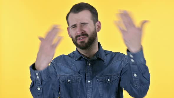 Disappointed Beard Young Man Reacting To Failure, Yellow Background