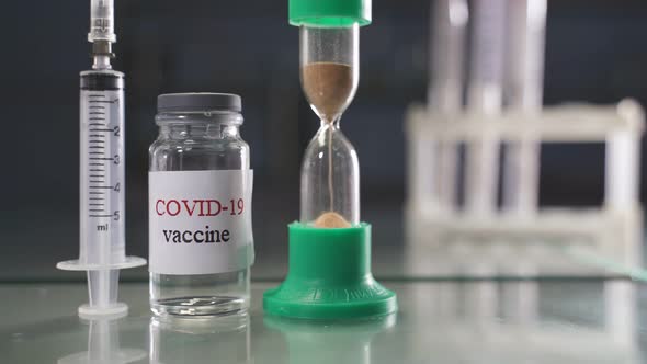 Closeup of the COVID19 Coronavirus Vaccine and Syringe Immunization and Treatment of Coronavirus