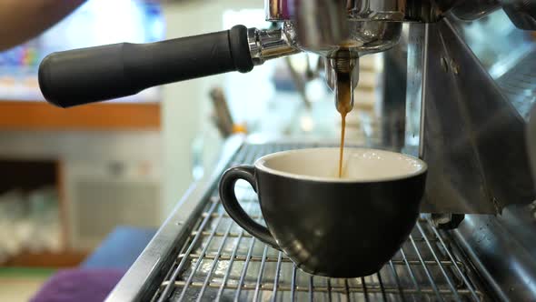 Preparing Cup of Coffee at Busy Cafe