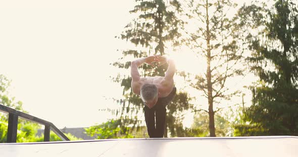 Man Practicing Yoga Asana Outdoor