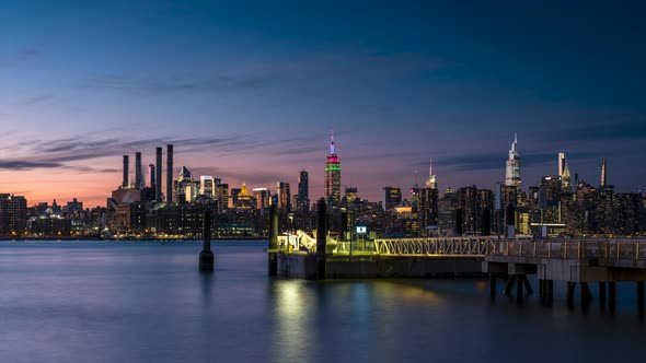 Day to Night Timelapse Sunset Over East River Midtown Manhattan Skyline and North 5th Street Pier at