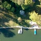 Lake Shore Drone Shot with Green Water and Boats - VideoHive Item for Sale