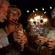 group of four people enjoying new year night celebrating with sparklers in the middle - VideoHive Item for Sale