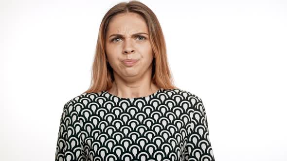 Nervous Angry Young Beautiful Blonde Girl Over White Background