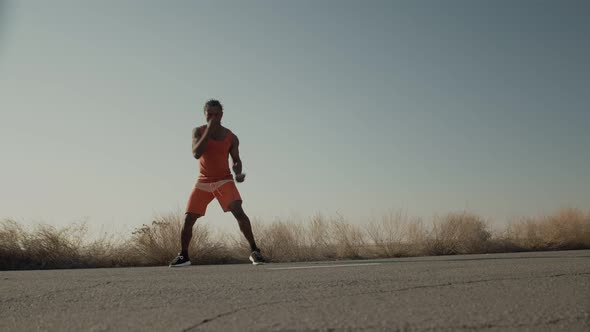 Athlete Actively Trains His Hands Standing Outdoor Down Front View