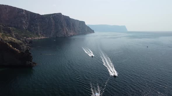 Aerial View From Above on Calm Azure Sea and Volcanic Rocky Shores