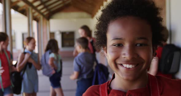 Girl smiling in the school corridor