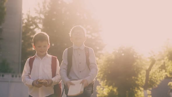 Young Guy Silhouette Throws Up Books and Friend Falls Down