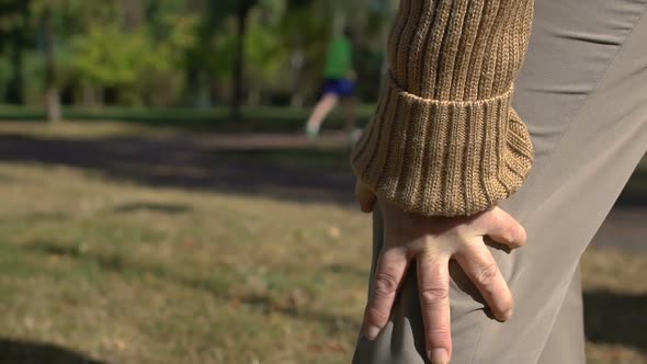 Old Woman Suffering Knee Pain Outdoors, Joint Inflammation, Osteoarthritis