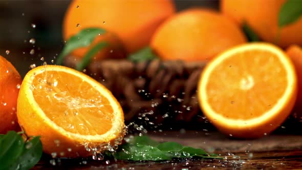 Super Slow Motion Orange Juice Drips on Half an Orange