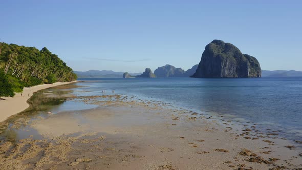 Aerial Fly Along Tropical Beach of El Nido Village Palawan Philippines