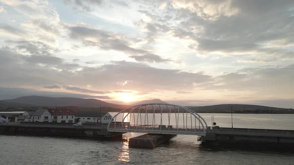 Flying Towards Michael Davitt Bridge With Scenic Sunset View In Achill Island, Ireland. - aerial for