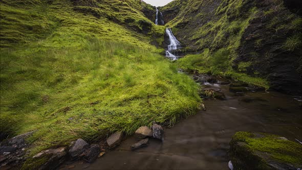 Motion time lapse of local waterfall in rural grass hill area of Gleniff Horshoe in county Sligo in