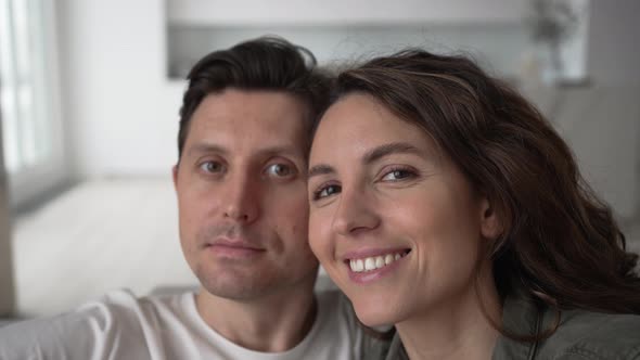 Husband and Wife Take Selfies Hugging and Smiling Broadly