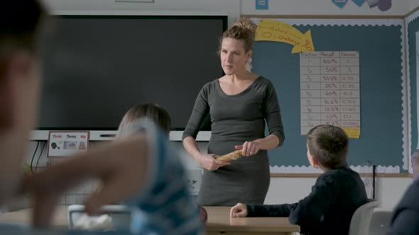 Children and teacher during a science lesson