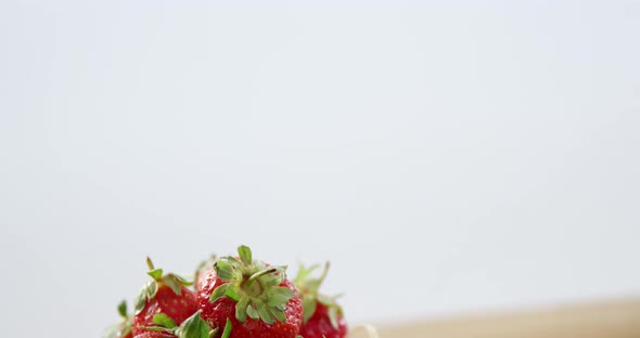 Fresh strawberries in wicker bowl