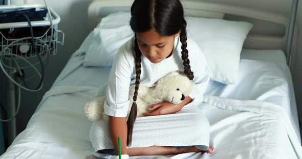 Girl drawing picture in a book