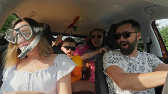 Crazy Funny Family with Children Traveling in the Car