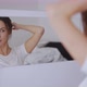 Glad Woman Doing Hair Near Mirror - VideoHive Item for Sale