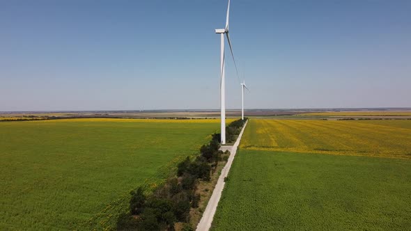 Aerial drone view of a flying over the wind turbine