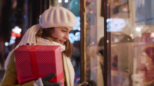 Happy woman during winter walking in the city