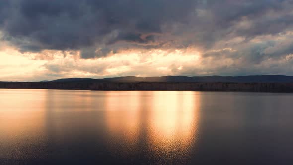 Aerial View of the Natural Landscape Forest on the Lake Shore at Sunset