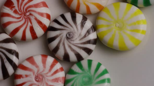Rotating shot of a colorful mix of various hard candies - CANDY MIXED 006