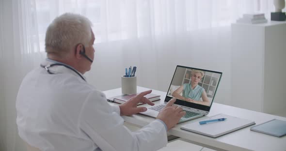 Online Appointment of Therapist, Adult Female Patient Is Consulting with Doctor By Internet, Talking