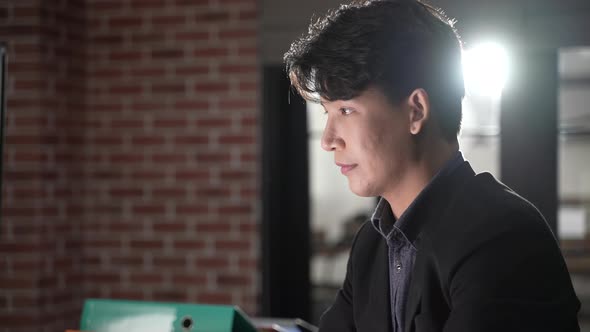 young businessman wearing suit working in business marketing work on computer laptop in home office