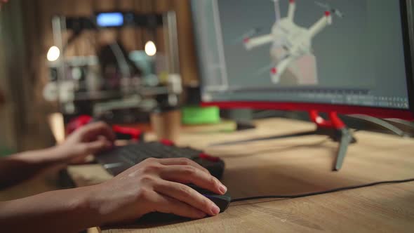 Close Up Engineer's Hands Working On Personal Computer And 3D Printer