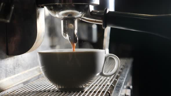 Barista Making Coffee in Bar. Espresso Preparation in Coffee Machine. White Steam Rising Up. Slow