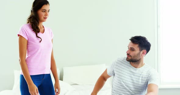Couple interacting with each other in bedroom