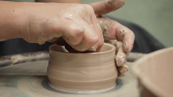 Sculpting on a Potter's Wheel of Glossy Clay