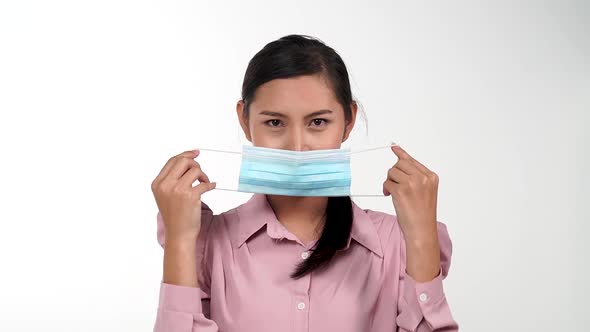 Asian young woman wearing protective mask in slow motion, Protection versus viruses and infection