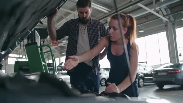 Working Together at Repair Garage alt