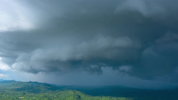 Aerial view Summer Thunderstorm and Black clouds moved over the mountains. alt