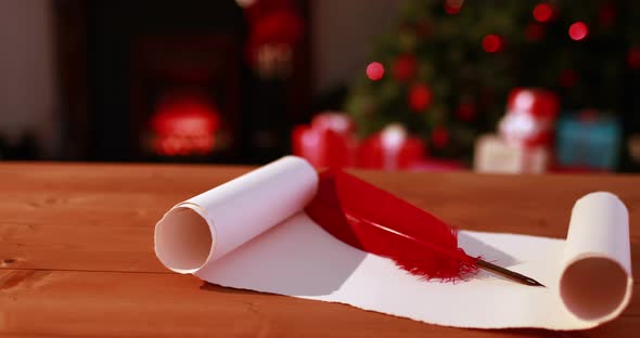 Scroll and quill on table at christmas 4k