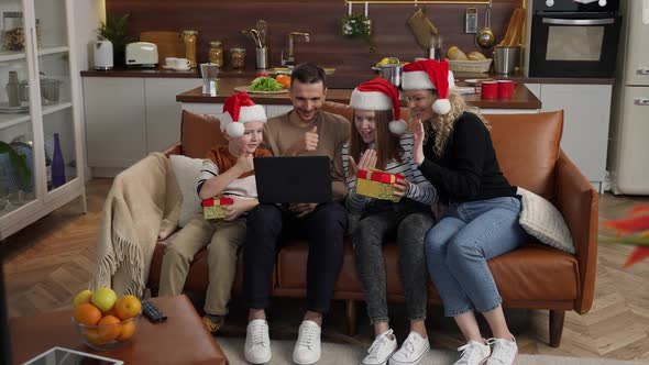 Joyful Family with Hearing Loss During Video Call