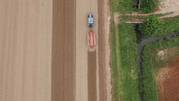 Tractor plows a field in Friuli Venezia Giulia, Italy