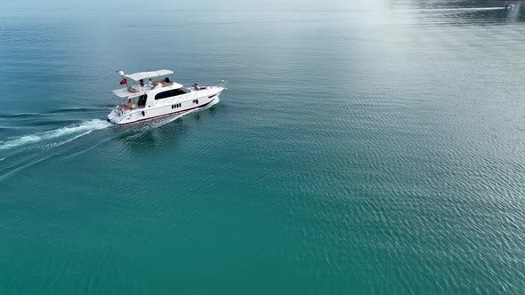 A couple rides a yacht aerial view 4 K Turkey Alanya