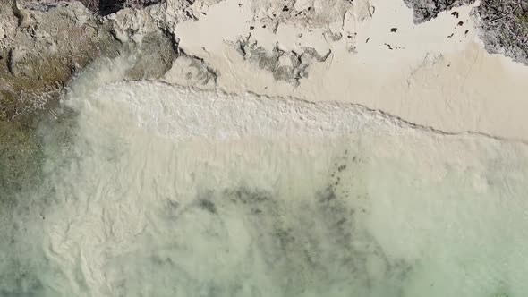 Vertical Video of the Ocean Near the Coast of Zanzibar Tanzania Aerial View