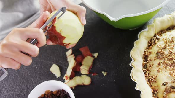 Woman pealing off apple skin 4k