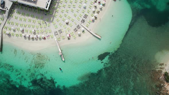 Aerial View Azure Beach with Empty Sun Loungers Balkan Coast Ionian Sea Albania