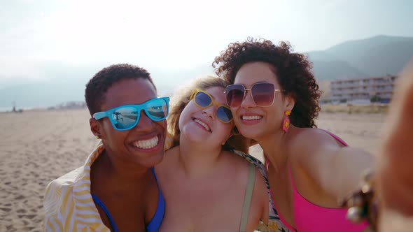 young women having fun on the beach