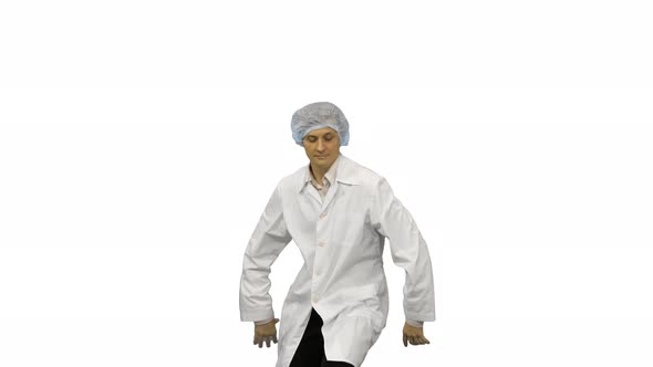 Young Male Doctor in White Robe and Protective Cap Dancing Modern Dance Looking at Camera on White