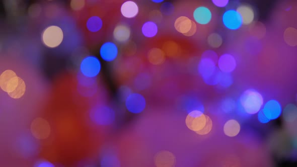 Shimmering abstract colored circles defocused christmas lights video. Blurred fairy lights.