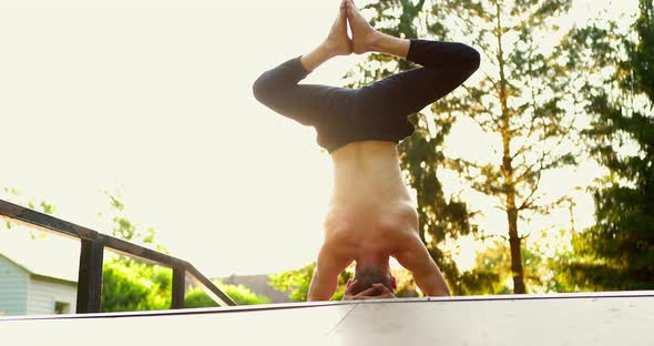 Barechested Yogi Practicing Yoga in Summer Park