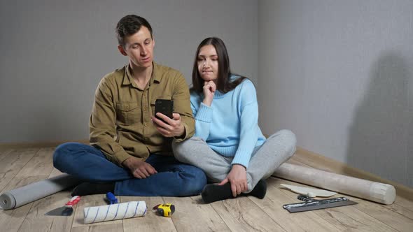 Married Couple Chooses Furniture and Room Decor on Floor