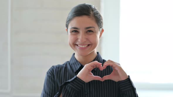 Young Indian Woman Showing Heart Sign with Hand